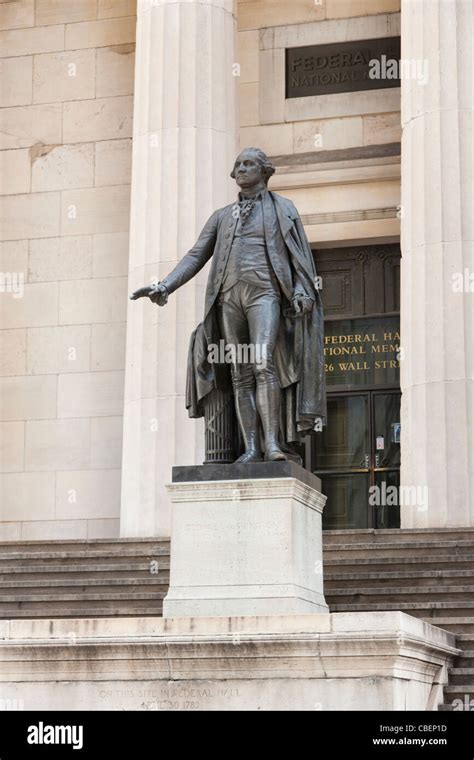 A statue of George Washington stands in front of the Federal Hall ...