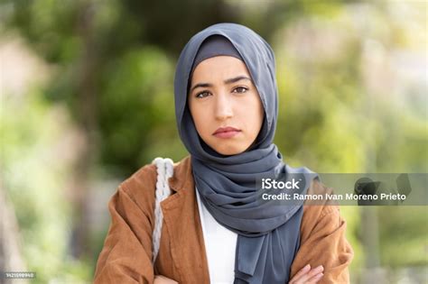 Serious Muslim Woman In Hijab Crossing The Arms Ourdoors Stock Photo