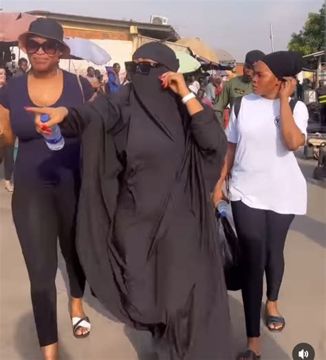 Regina Daniels covers entire body and face as she wears Niqab to the market (video) | The ...