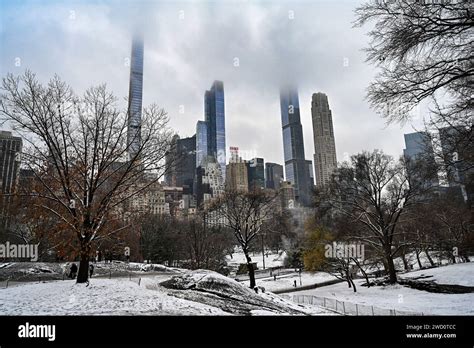 People Walk In Central Park As Snow Blankets New York City Breaking A