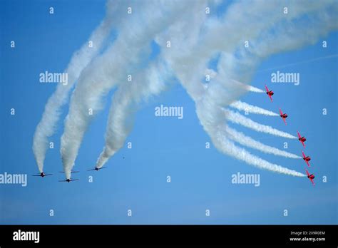 The Raf Red Arrows Display Team Perform During The Iwm Duxford Air Show