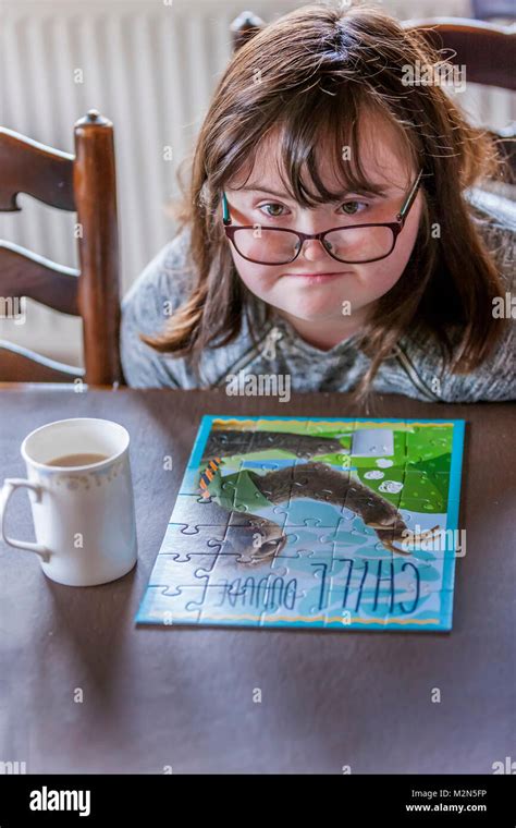 Happy Child With Downs Syndrome Always Ready To Help Stock Photo Alamy