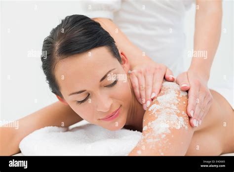 Peaceful Brunette Getting A Salt Scrub Beauty Treatment Stock Photo Alamy