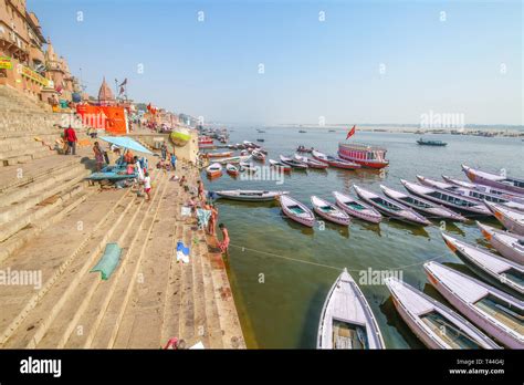 View Of Ganges River Ghat At Varanasi With Ancient Architecture And