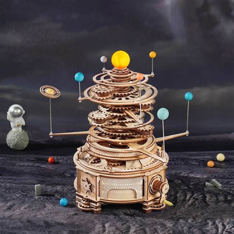 This Wooden Solar System Orrery Has a Glowing Sun