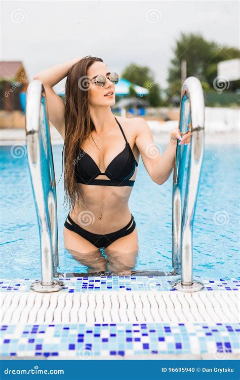 Beautiful Woman In Bikini Entering Swimming Pool Summer Time Stock