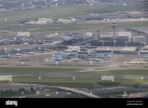 The Airport Terminal With Blue KLM Jet Planes And Others At The Gates