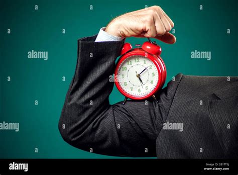 Bearded Businessman In Suit Holding Red Alarm Clock Time Management