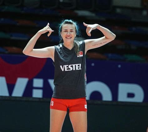 A Woman In Black Shirt And Red Shorts Standing On Top Of A Basketball