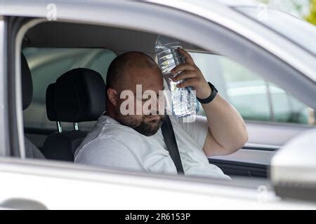 Weary Overweight Man Drives Car With Broken Air Conditioner In Hot