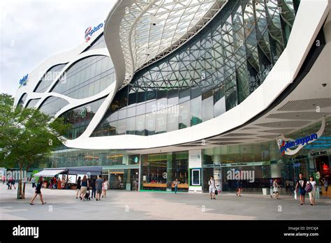 People shopping at Plaza Singapura. Plaza Singapura is a contemporary ...