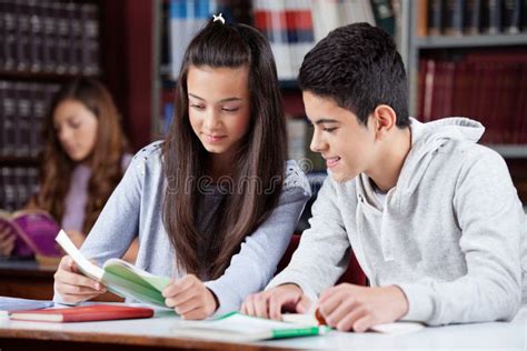 Teenage Boy with Friends Studying at Desk Stock Image - Image of classroom, education: 33198713