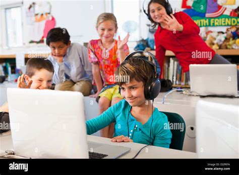 Students using laptops in classroom Stock Photo - Alamy