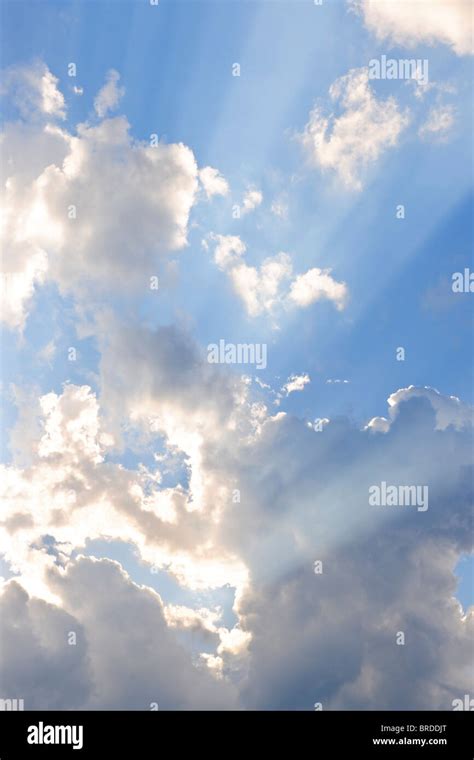 Background Of Blue Sky With Sun Rays And Clouds Stock Photo Alamy