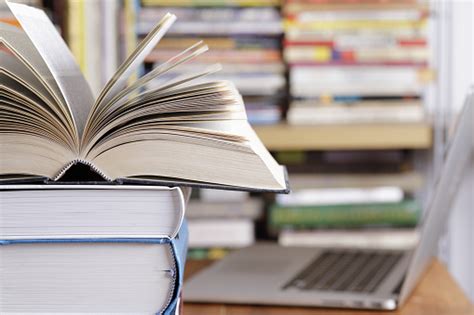 Stack Of Books And Computer At The Library Stock Photo Download Image