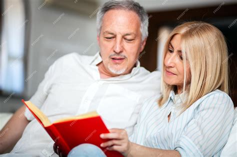 Premium Photo Mature Couple Reading A Book Together