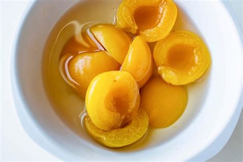 Premium Photo Ready To Eat Apricot Compote In A White Bowl