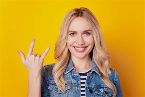 Premium Photo Portrait Of Rude Hipster Fan Girl Showing Horns Rock