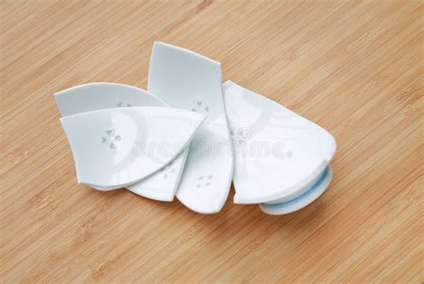 Pieces of Broken Ceramic Bowl on Wood Background Stock Image - Image of break, container: 131956117