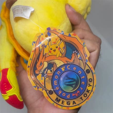 Boneka Pokemon Pikachu Kostom Ponco Charizard Pokemon Center 25cm