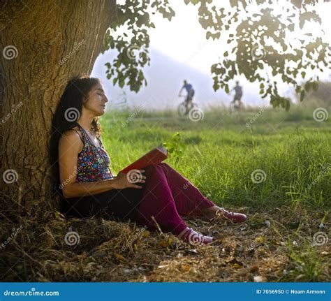 Woman Reading Book Under Tree Stock Photo Image