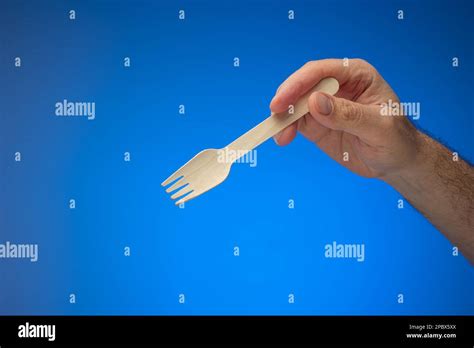 Hand Holding Spoon Fork On Hi Res Stock Photography And Images Alamy