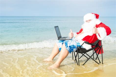 Funny Santa on the Beach Working on Laptop. Stock Image - Image of ...