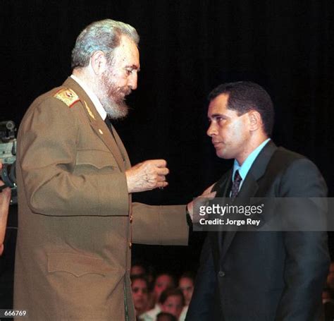 Cuban President Fidel Castro, left, awards Juan Miguel Gonzalez one... News Photo - Getty Images