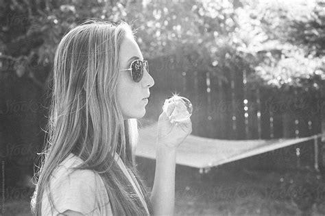 «teenage Girl With Long Blonde Hair And Sunglasses Blowing Bubbles Del