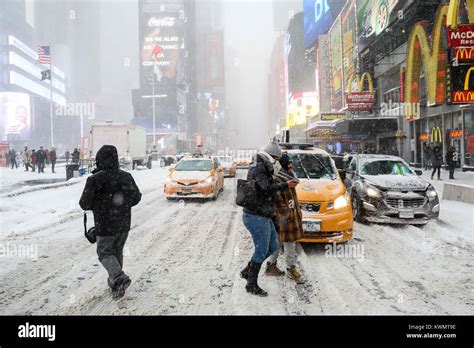 Times Square on a day when heavy snowfall hits Manhattan Island in New ...