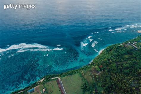 Drone View Of Scenic Coastline With Ocean Waves And Current Canal In