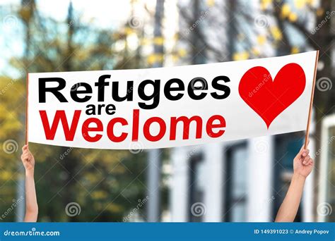 Two People Holding Refugees Are Welcome Banner Stock Image Image Of