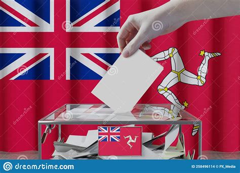 Isle Of Man Flag Hand Dropping Ballot Card Into A Box Voting