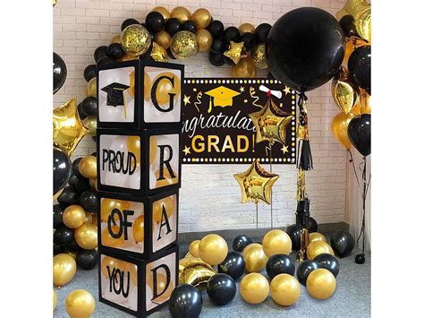 A Black And Gold Graduation Party With Balloons