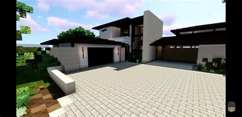 A Large Modern House Is Shown In This Minecraft Video Game Screen