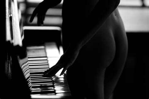 Premium Photo Midsection Of Naked Woman Standing By Piano