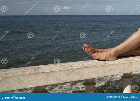 The Holiday Vacation Woman Legs Close Up Of A Girl Sitting On A Large