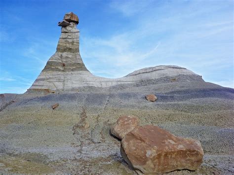 Boulders Below A Layered Mound Topped By A Graceful Hoodoo San Juan