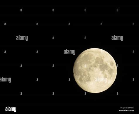 Full moon on black background Stock Photo - Alamy