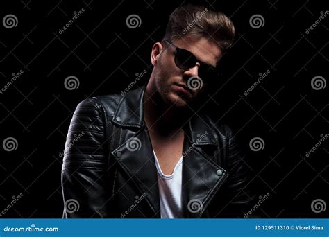 Portrait Of Man Wearing Black Leather Jacket And Sunglasses Stock Photo