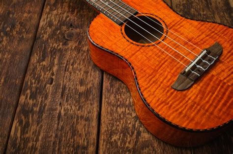 Premium Photo Ukulele Hawaiian Guitar On Wooden Backgroun Close Up