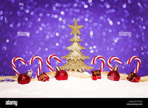 Christmas Ornament In Snow On Glitter Background Stock Photo Alamy