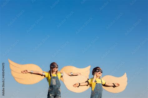 Happy children playing outdoor Stock Photo | Adobe Stock