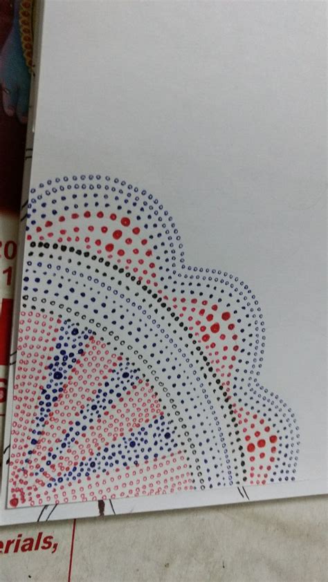 An Envelope With Red White And Blue Dots On It