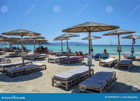 Deckchairs Under Canopy Shade For Resting On Beach Sand During Summer