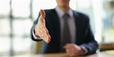 Premium Photo Businessman In Suit Extending His Hand For Handshake To