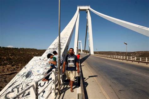 This Picture Taken On August 17 2018 Shows People Crossing The Wadi