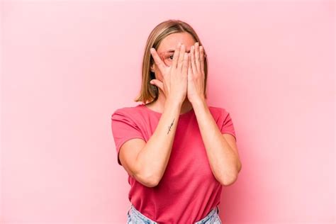 Premium Photo Blink At The Camera Through Fingers Embarrassed Covering Face