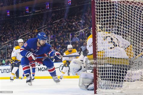 Chris Kreider Of The New York Rangers Shoots The Puck Against The