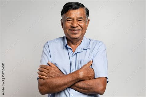 Portrait Asian elderly man. Smiling old man with arms crossed looking ...